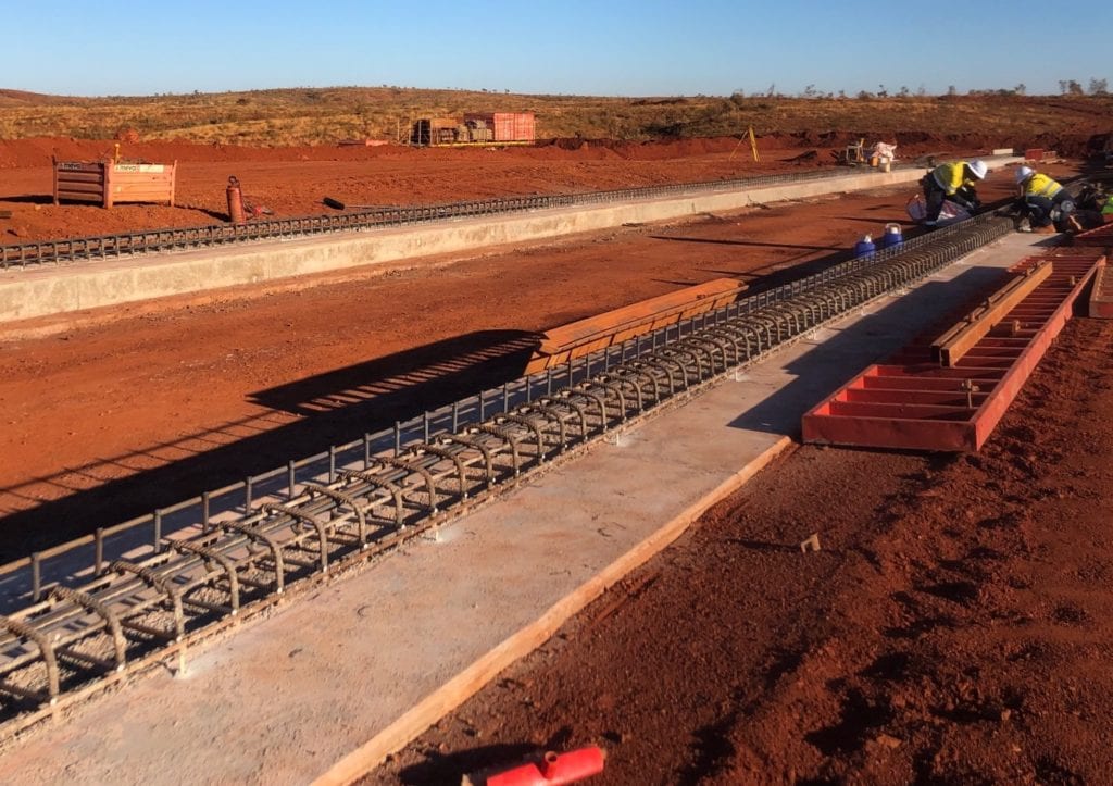 Close view of concrete footings under construction