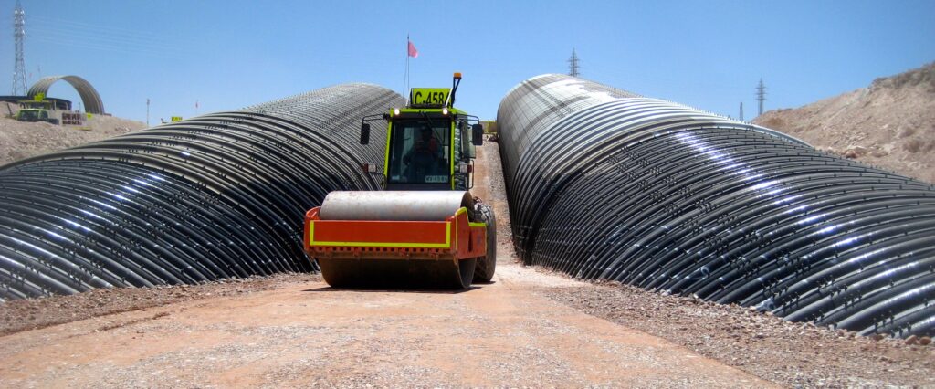 Backfilling mine site conveyor tunnels under construction